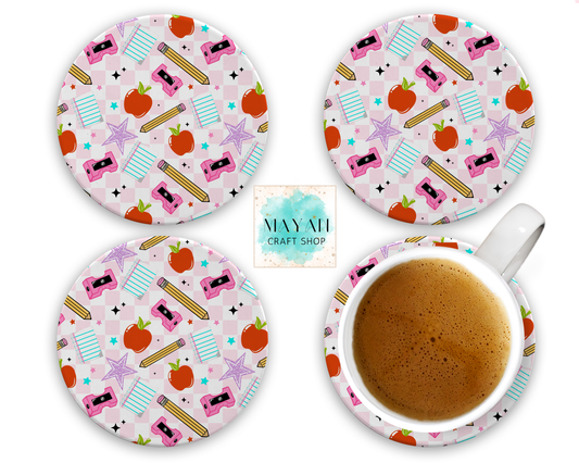 Set of four round coasters with a colorful pattern on a white background, one coaster with a cup of coffee.