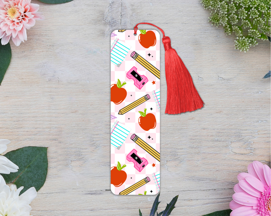 Bookmark with colorful design on a wooden surface with flowers