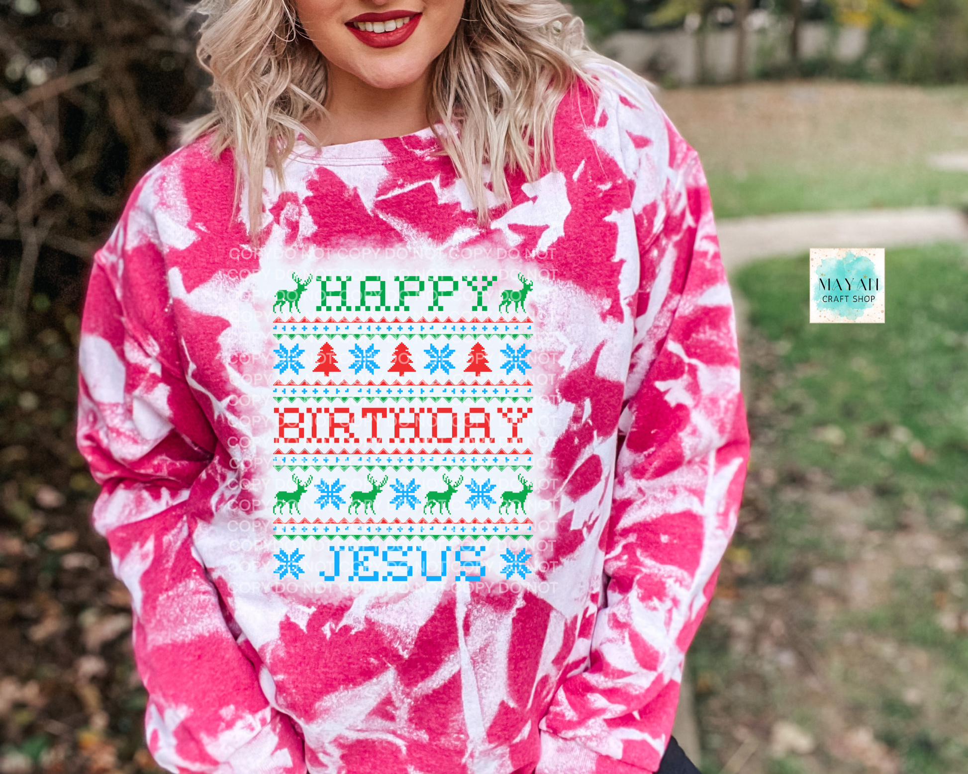 Person wearing a pink and white tie-dye sweatshirt with 'Happy Birthday Jesus' text.