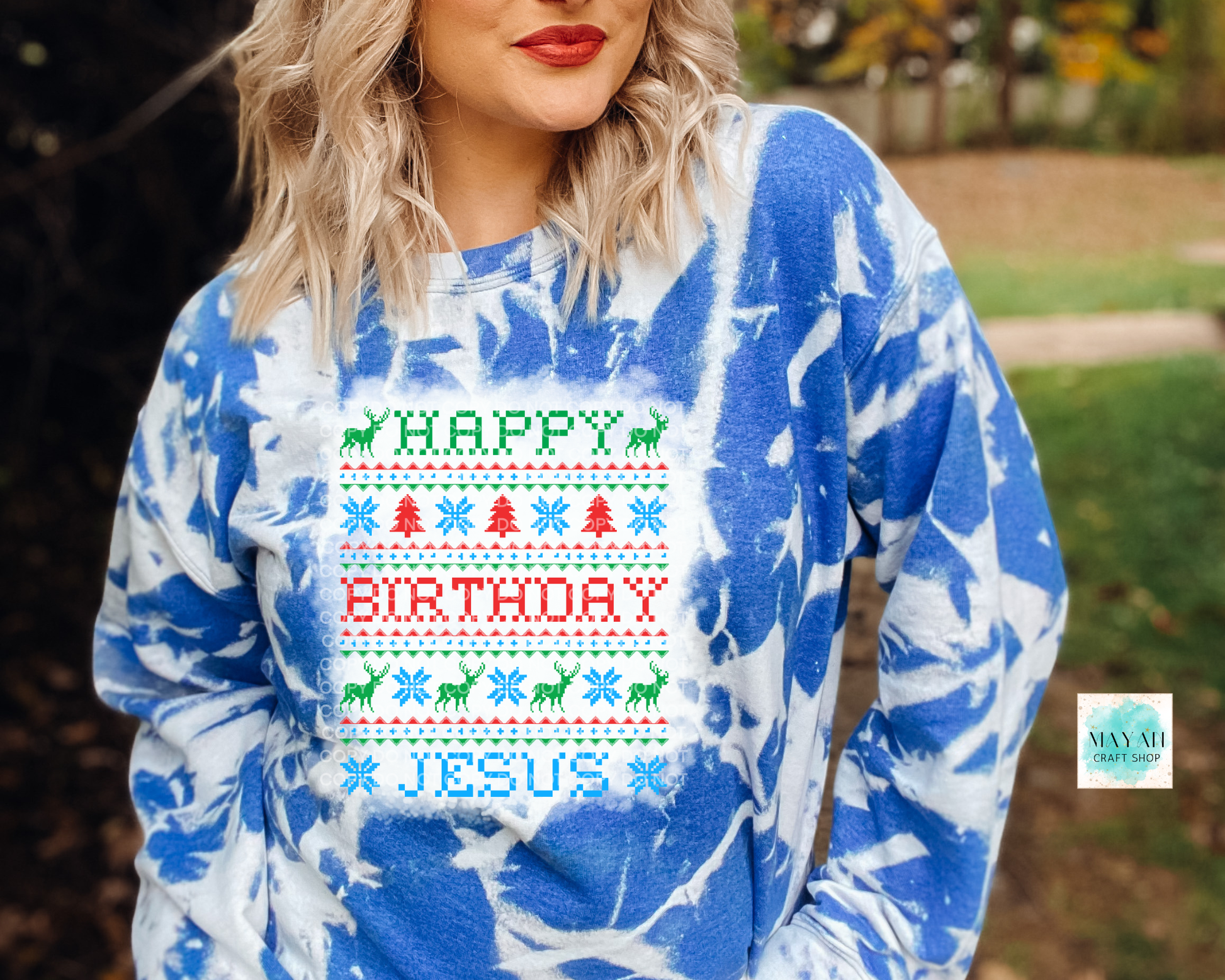 Person wearing a blue and white patterned hoodie with 'Happy Birthday Jesus' text.