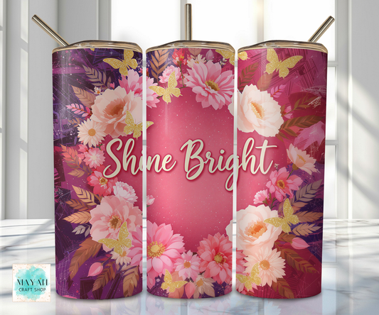 Three floral tumblers with 'Shine Bright' text on a white background