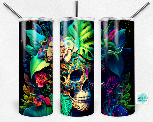 Three colorful tumblers with skull designs and leaf patterns on a white background.