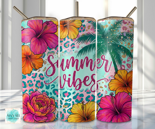 Three colorful tumblers with floral and palm tree designs on a white background.