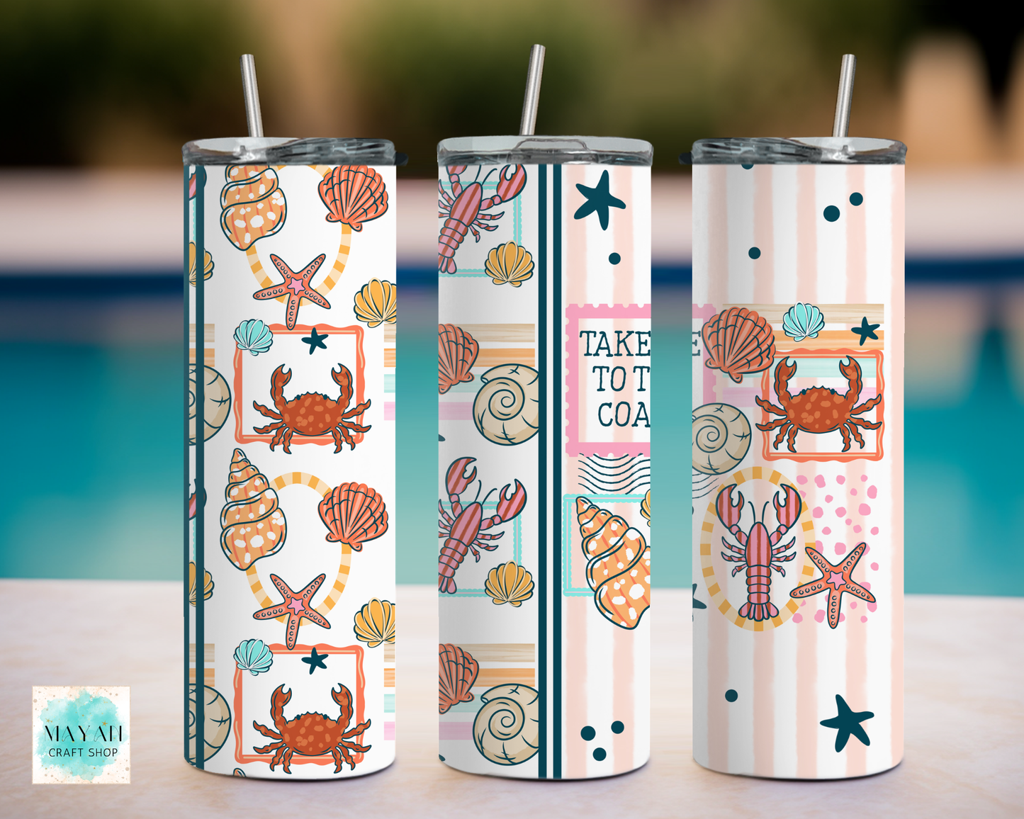 Three tumbler with sea-themed designs by a poolside.