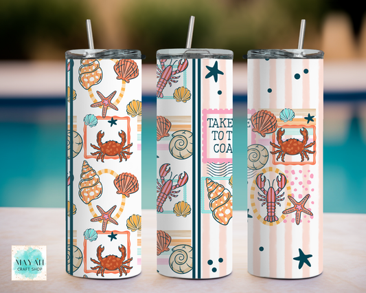 Three tumbler with sea-themed designs by a poolside.