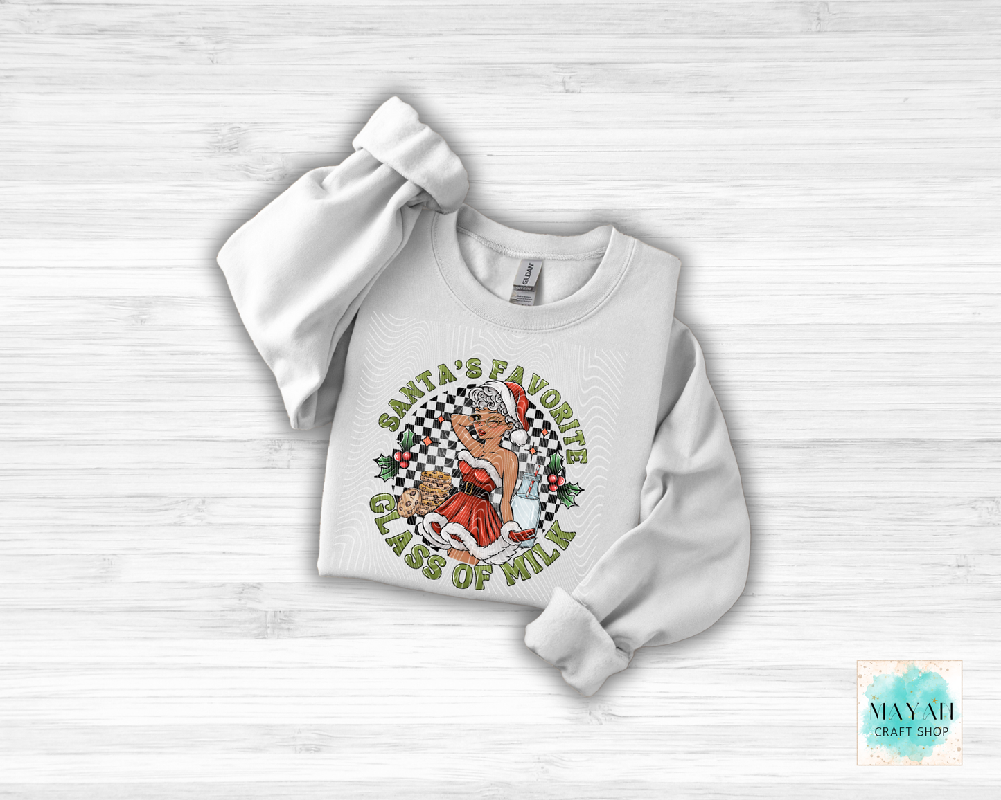 White sweatshirt with graphic design on a light wooden surface