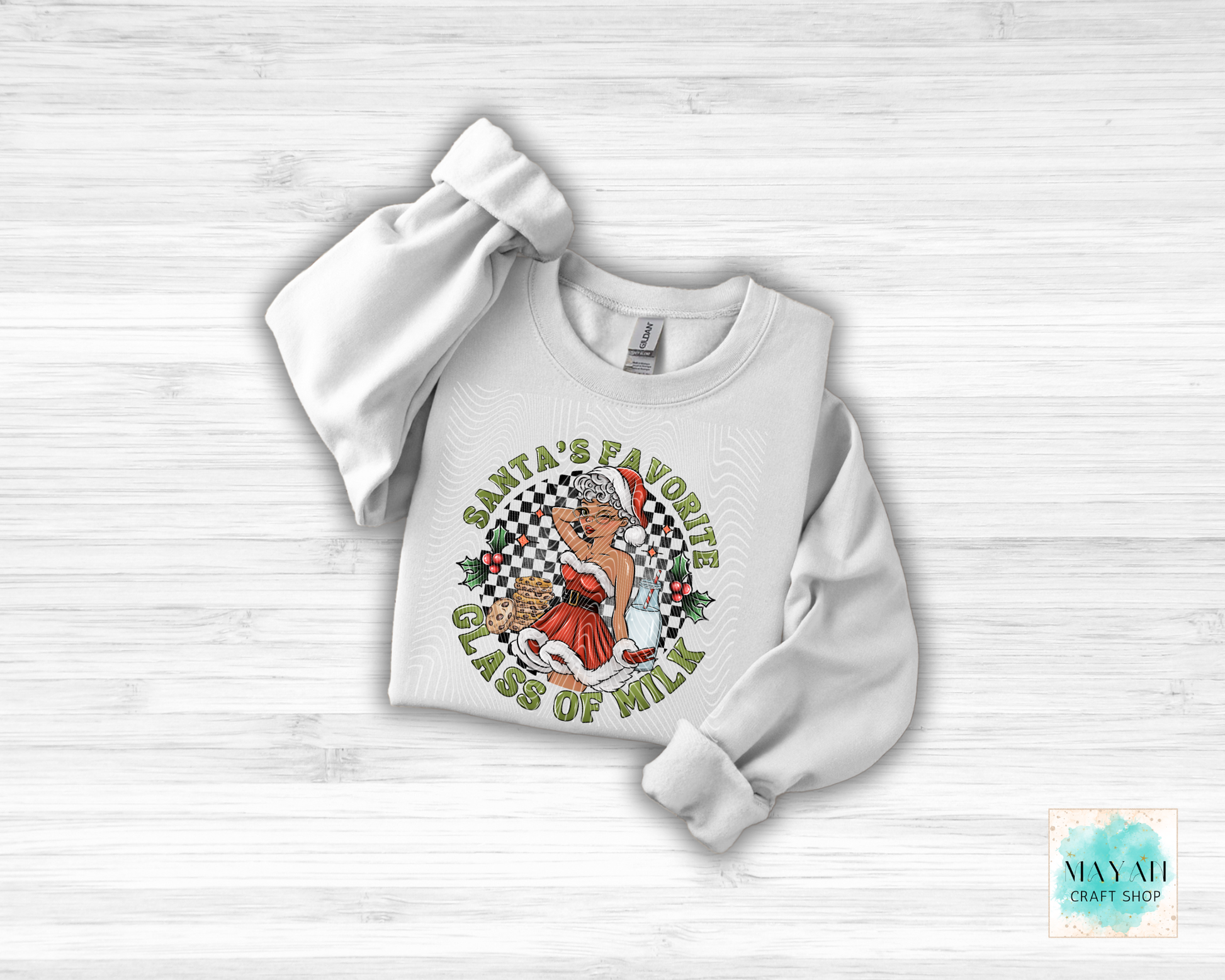 White sweatshirt with graphic design on a light wooden surface