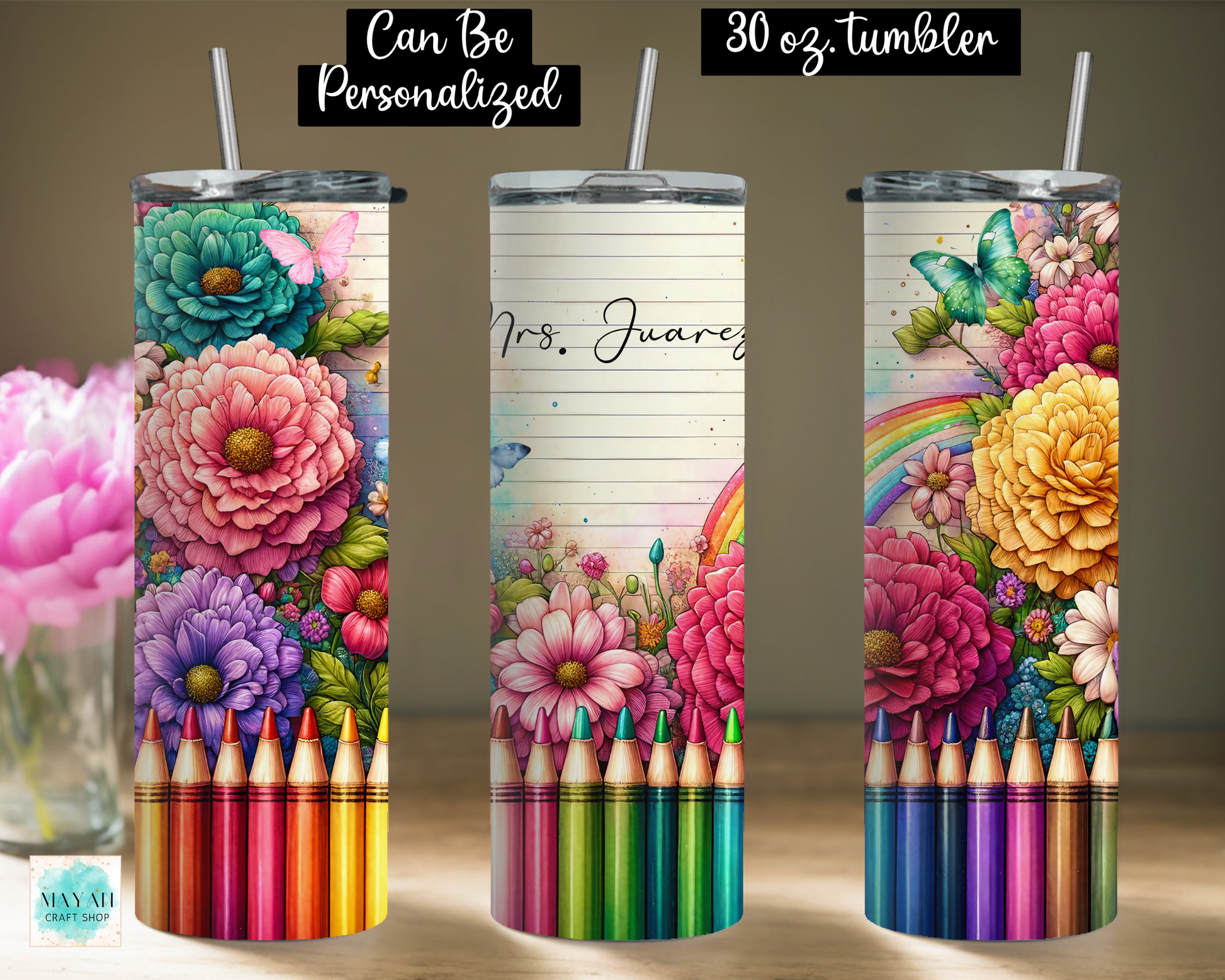 Three views of a 30 oz customizable skinny tumbler with a colorful floral and crayon design, shown on a tabletop with a blurred pink flower vase in the background.