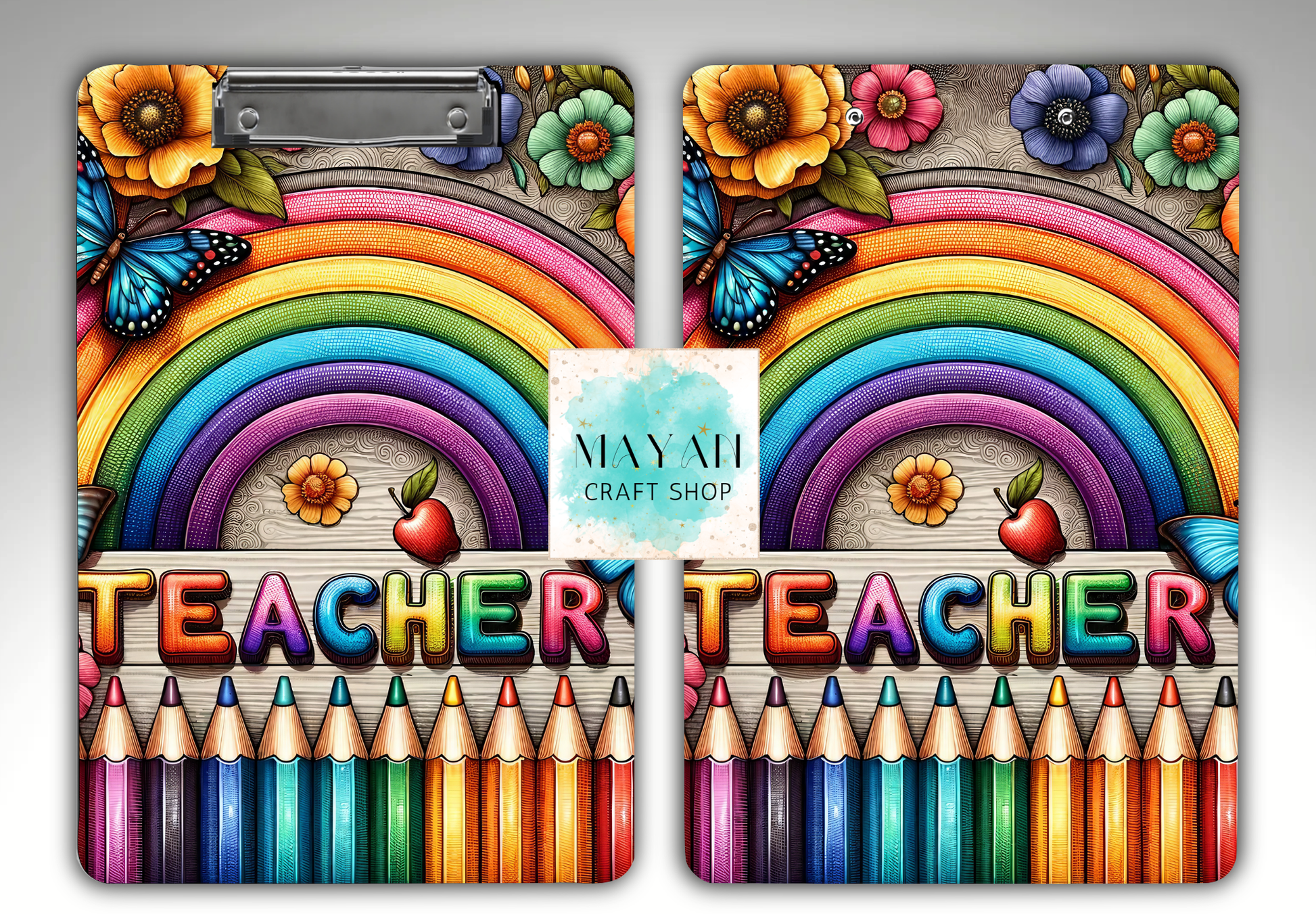A set of two matching clipboards featuring a colorful retro design with a rainbow, flowers, butterflies, the word 'TEACHER' in rainbow letters, and a row of colored pencils. 