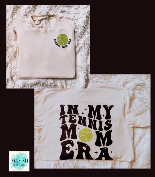 In my tennis mom era heather natural shirt. -Mayan Craft Shop