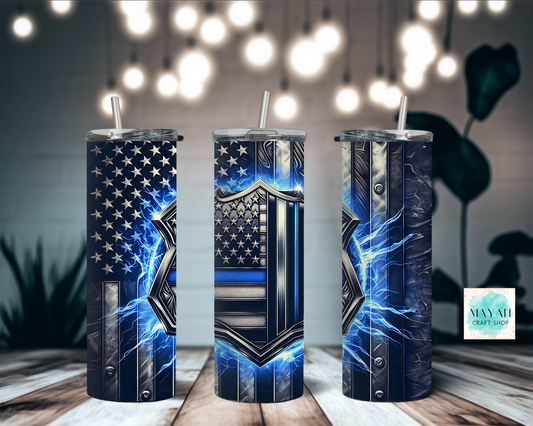 Three cylindrical tumblers with American flag designs on a wooden surface.