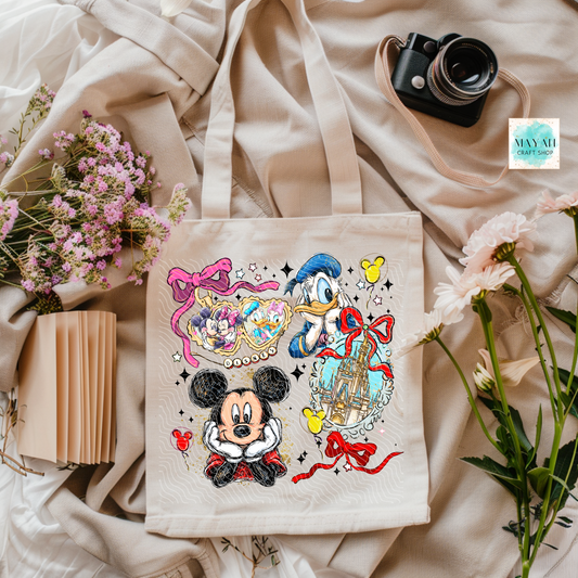 Tote bag with cartoon characters on a soft fabric background with flowers and a camera.