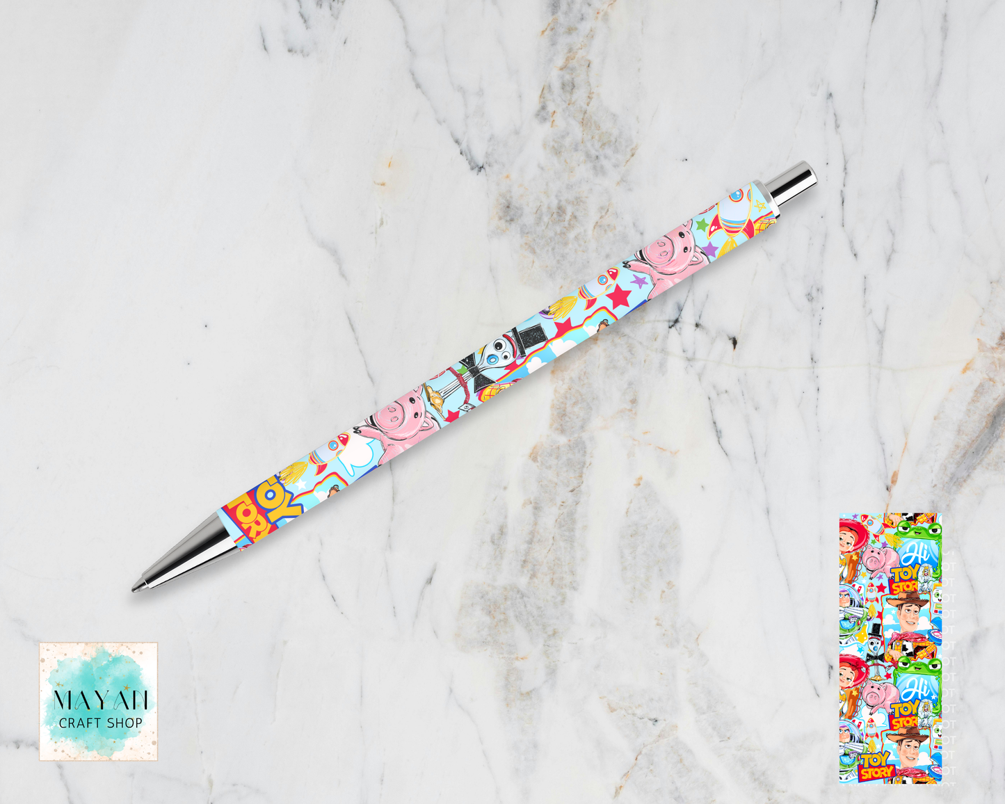 Colorful pen with character design on a marble surface.