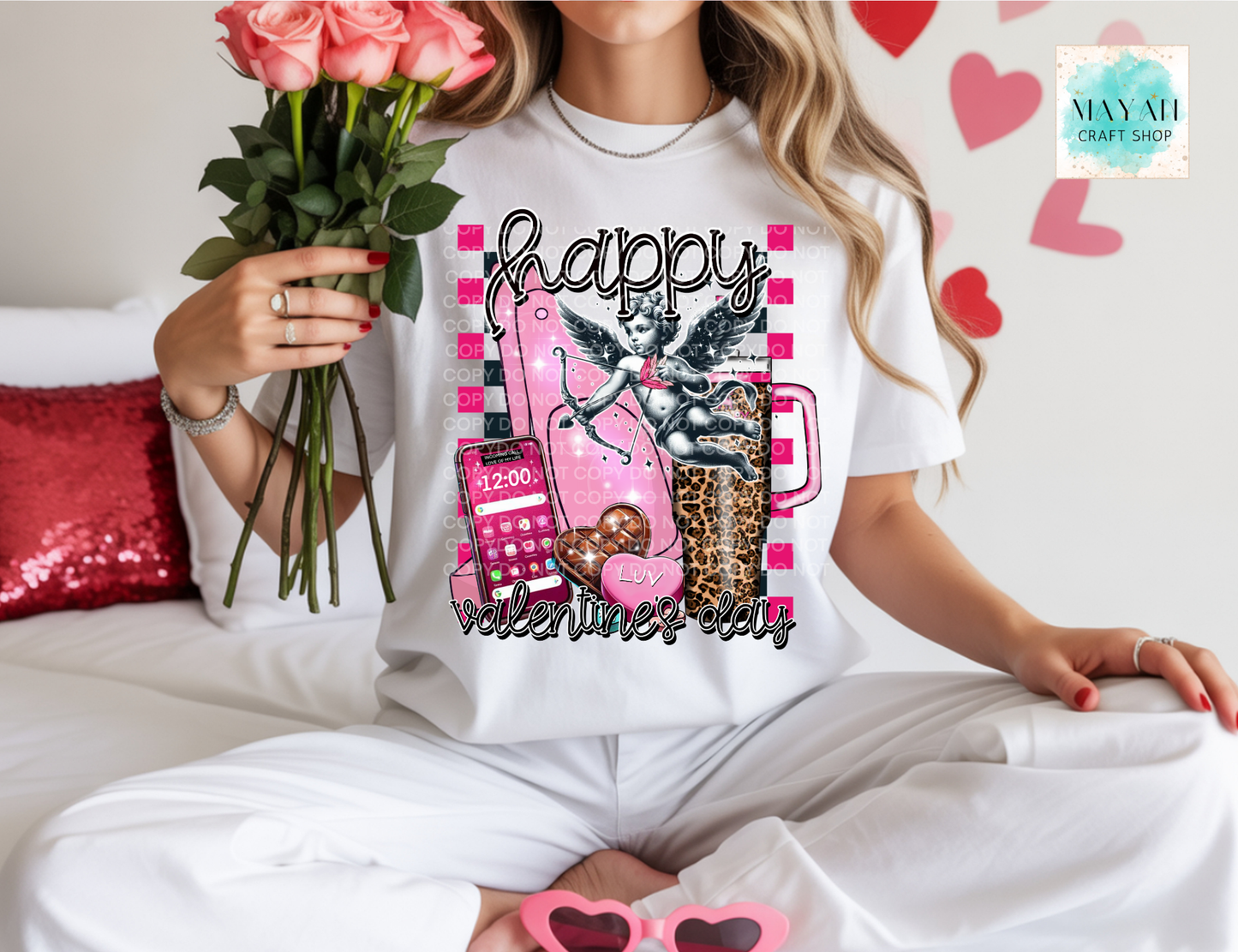 Person wearing a white t-shirt with Valentine's Day design, holding flowers and sunglasses.