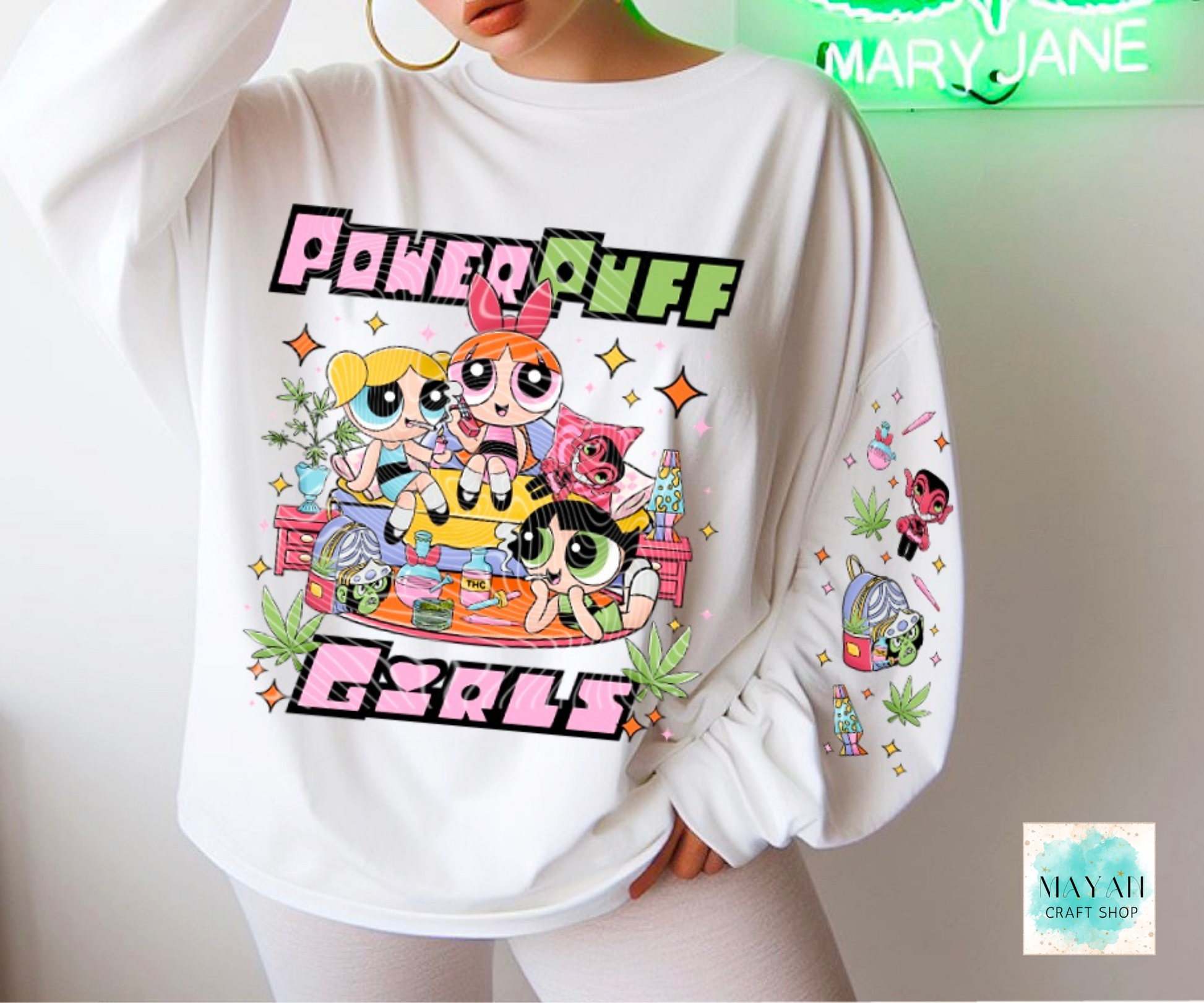 White sweatshirt with a vibrant graphic design on a neutral background