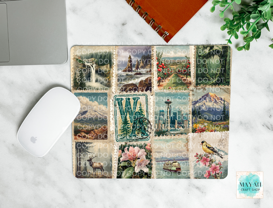 Mouse pad with various designs on a marble surface with a laptop and mouse.