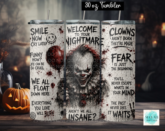 Three views of a 30 oz tumblers with a horror clown design, displayed on a wooden surface with a Halloween background including a jack-o'-lantern and spooky lights. The tumblers feature a distressed white background with black text and a central graphic of a creepy clown face with red blood splatters.