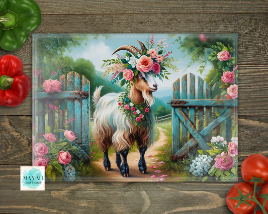 Cutting board of a goat with flowers on a wooden background