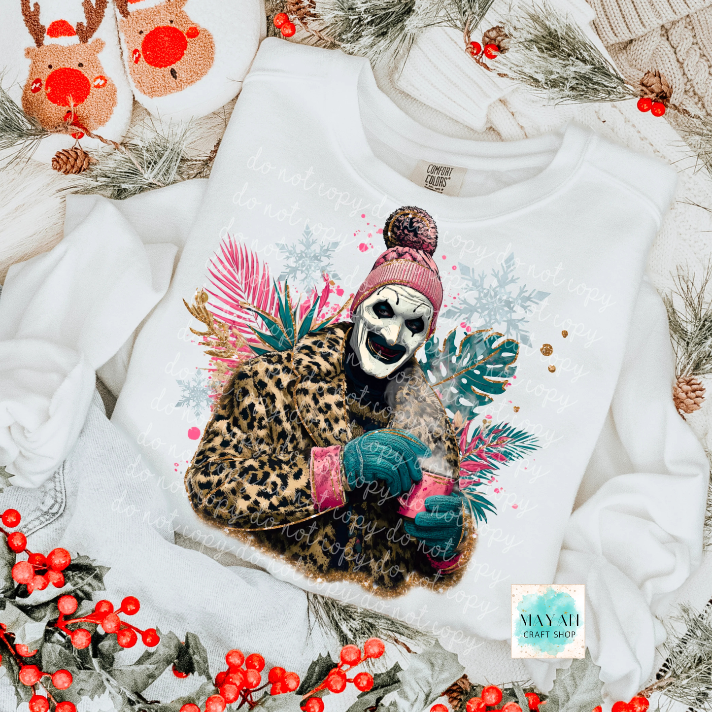 White sweatshirt with a colorful graphic of a skull, leopard, and cactus on a decorative background with holly berries and pine cones.