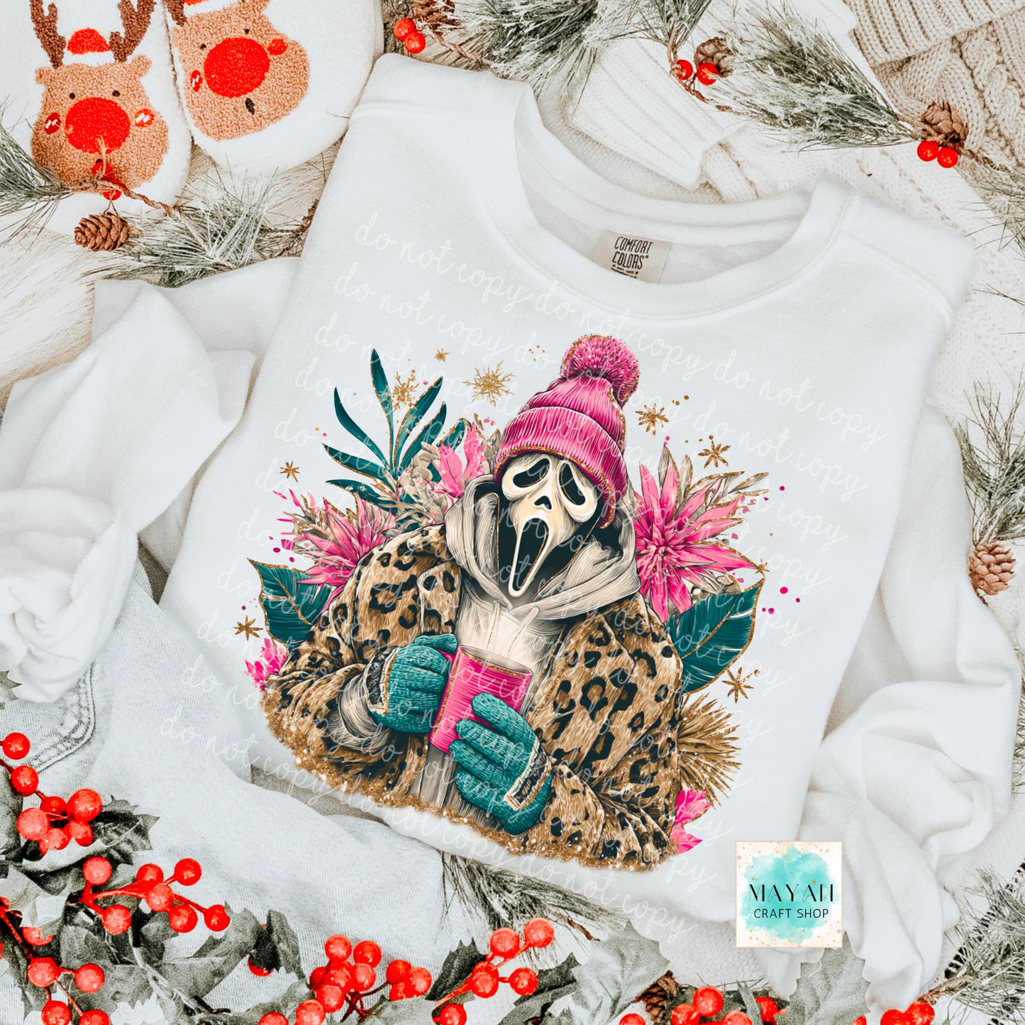 White sweatshirt with a sloth graphic wearing a pink hat and green gloves, surrounded by Christmas decorations.