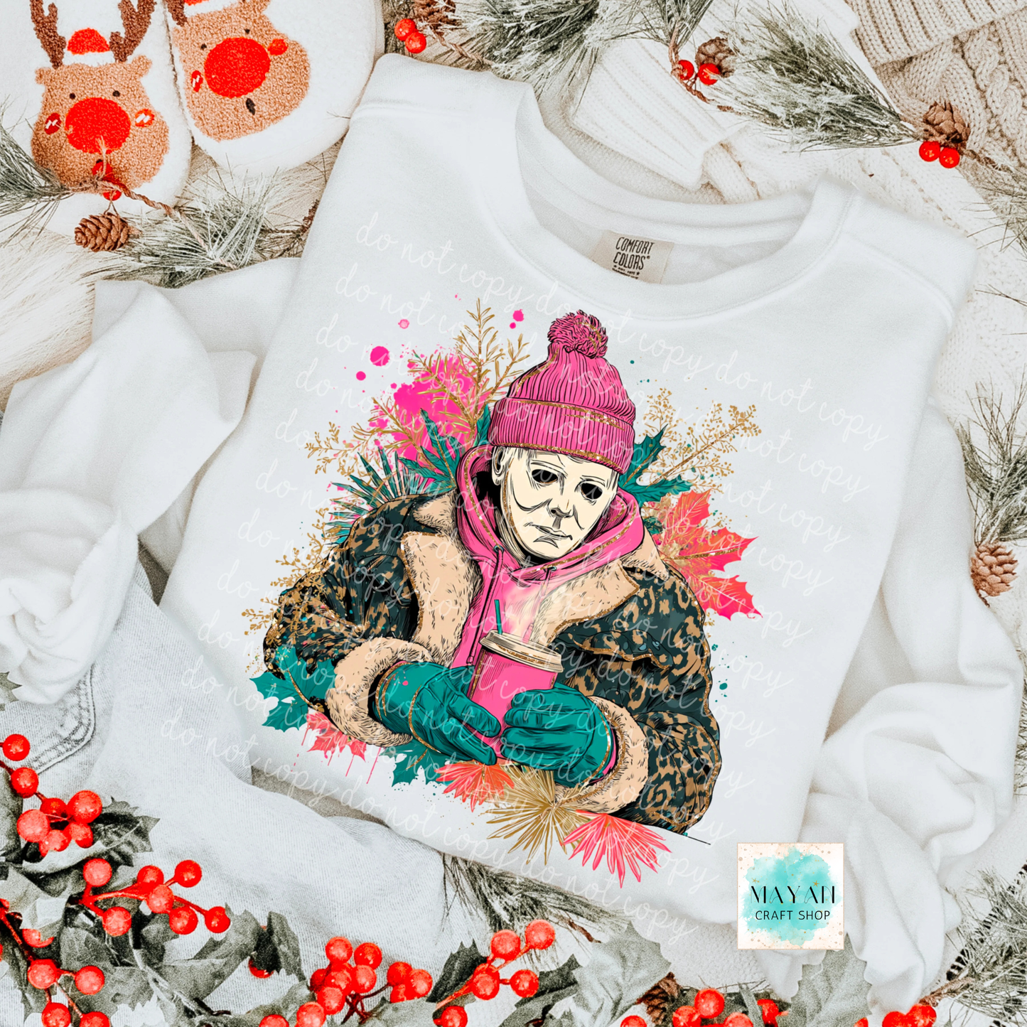 White sweatshirt with a colorful graphic design of a person in winter clothing, surrounded by Christmas decorations.