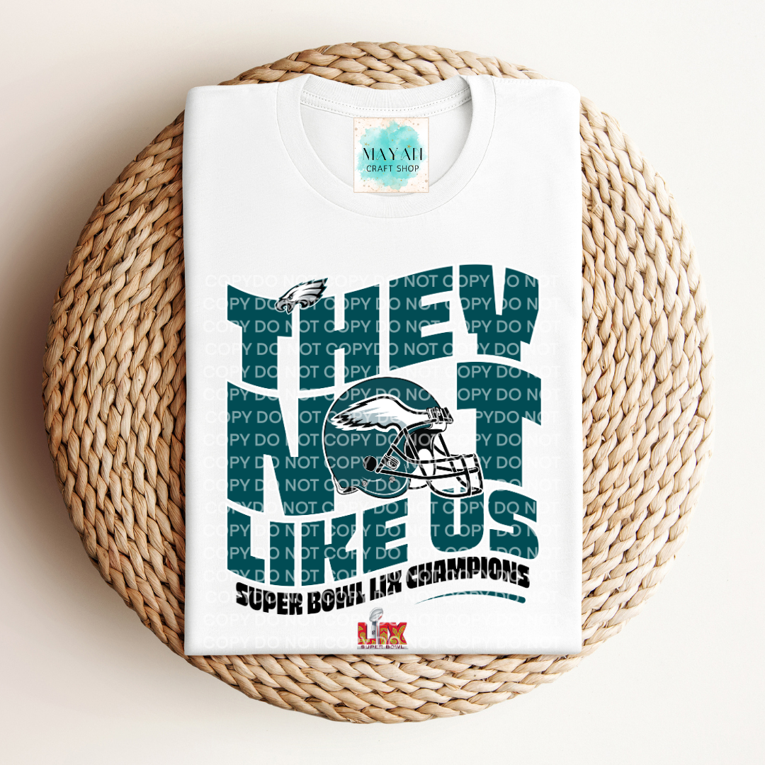 SB 2025 champs not like us white shirt. -Mayan Craft Shop