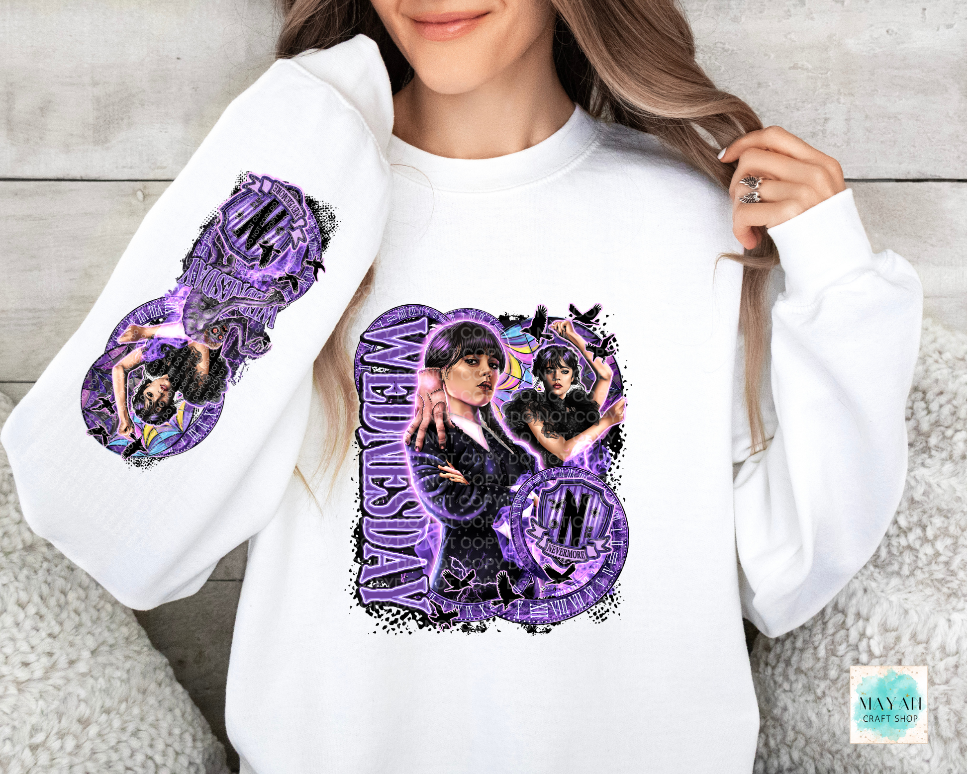 Purple design in white sweatshirt with sleeve design.