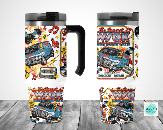 Travel mug with colorful design featuring a van and text on a white background