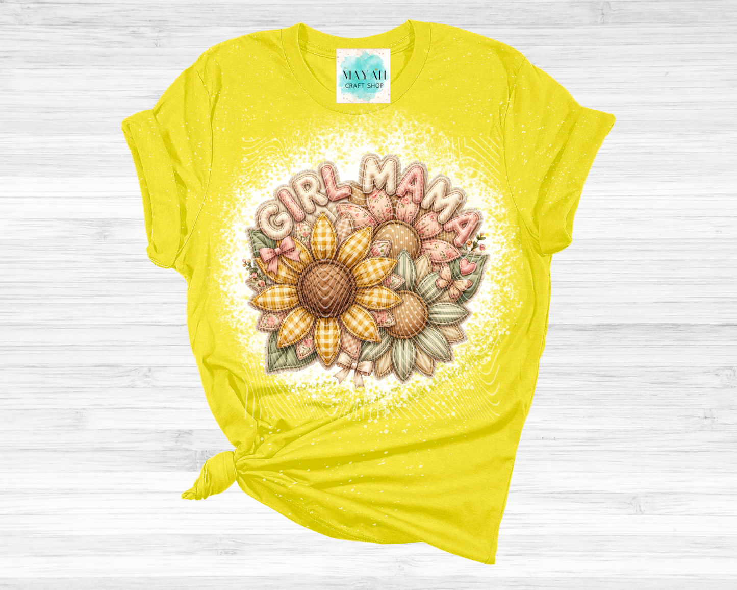 Yellow t-shirt with 'Girl Mama' design featuring a sunflower on a white wooden background